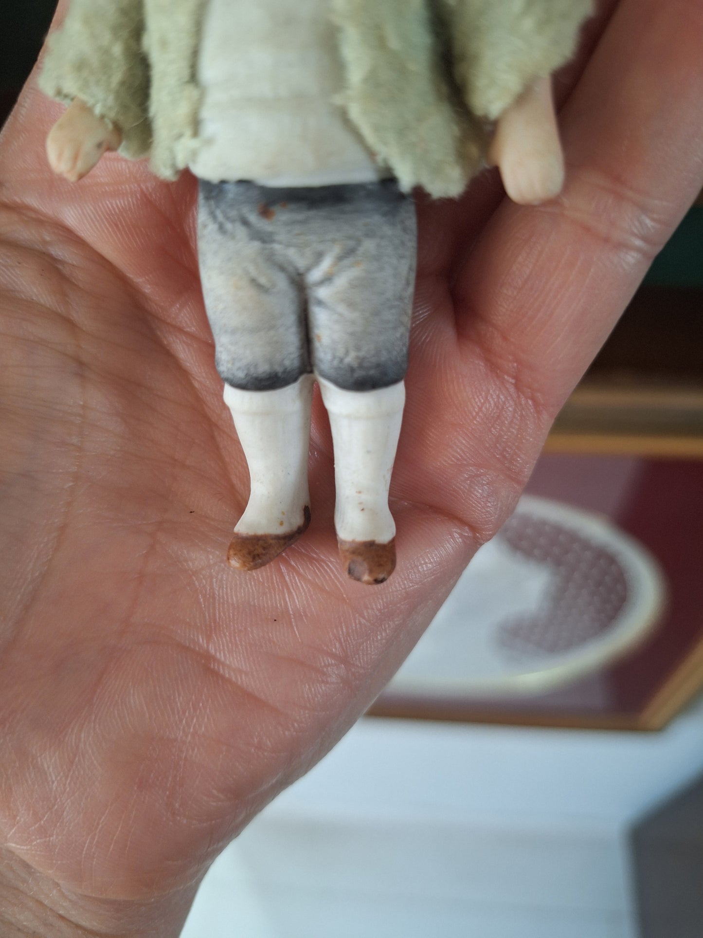 Miniature antique jointed bisque doll