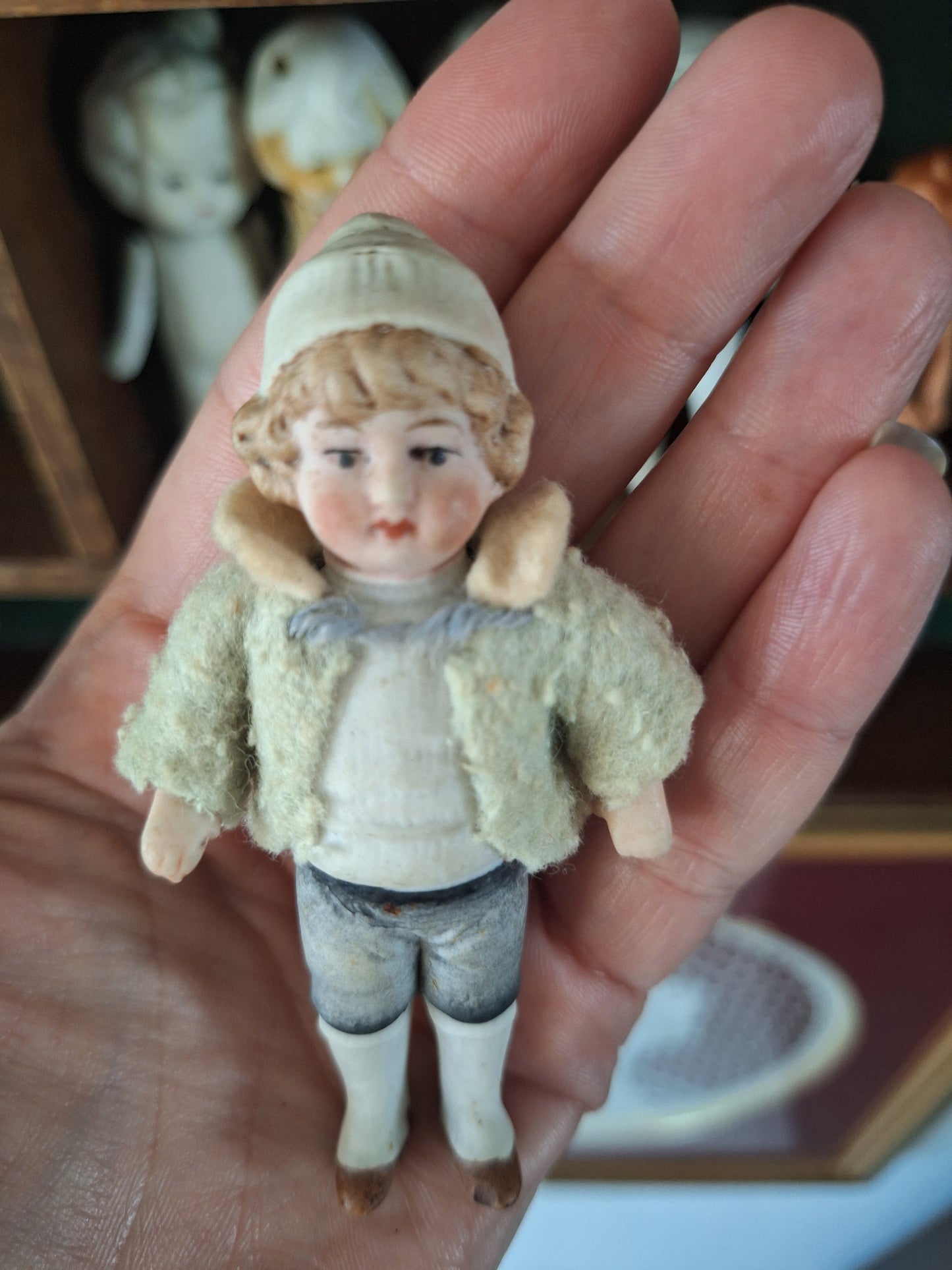 Miniature antique jointed bisque doll