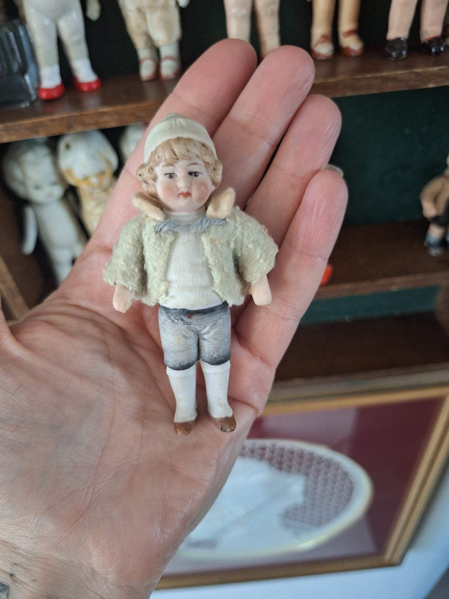 Miniature antique jointed bisque doll