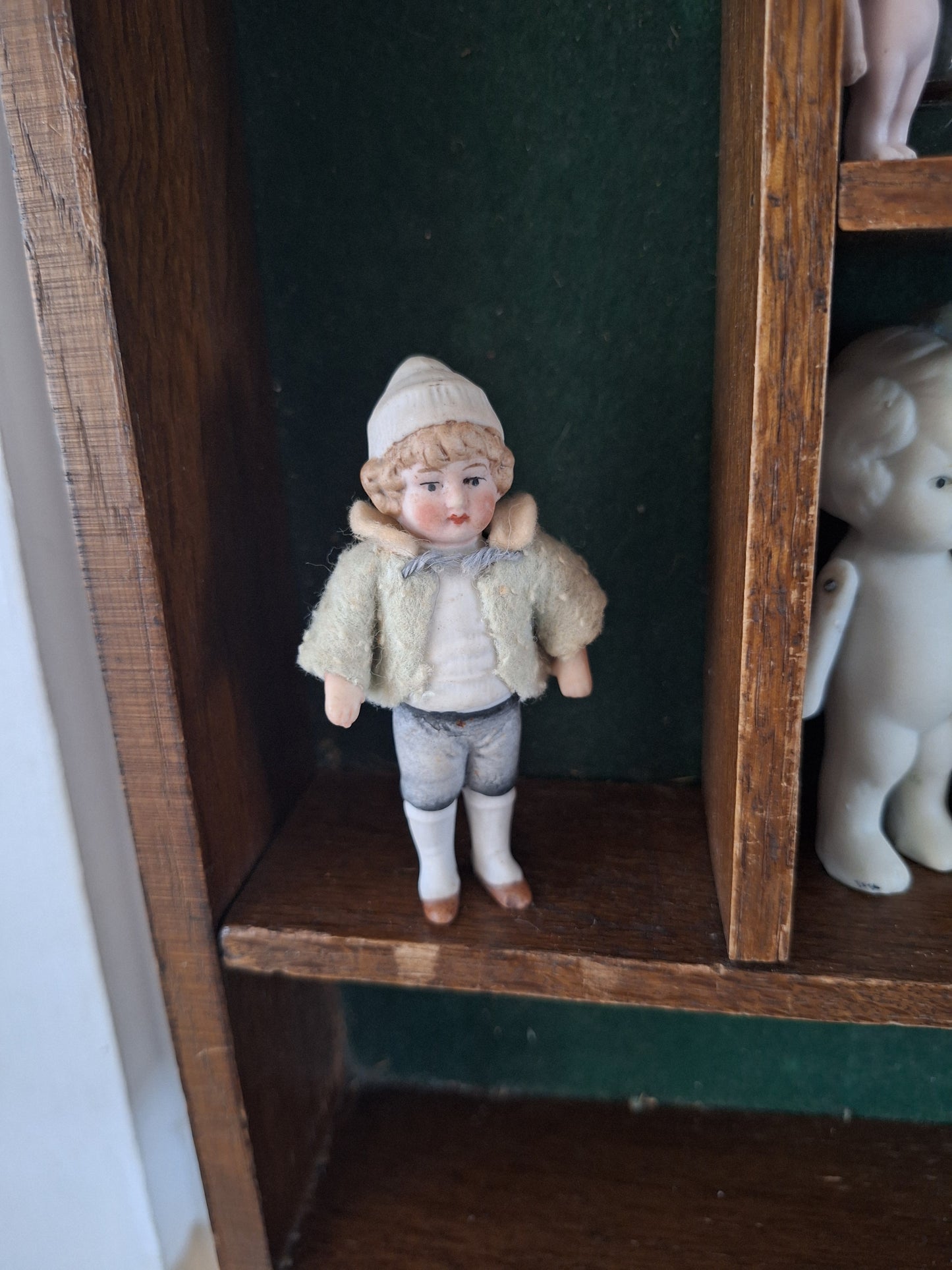 Miniature antique jointed bisque doll