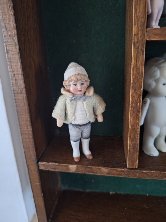 Miniature antique jointed bisque doll